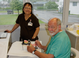 Photo of Dr. Thomas Taylor with a dental assistant 