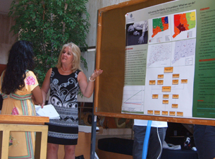 Photo of Cheryl Marenick speaking to a biomedical science student