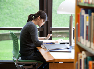 Photo of a student in the library