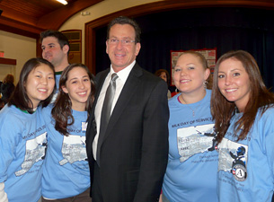 AmeriCorps members with the governor. From left to right are Anna Chang, Sara Servin, Jennifer Sweat, and Erin Royer.