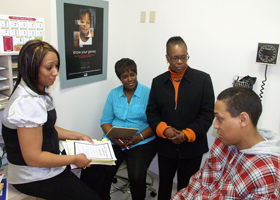 Photo of Delita Rose-Daniels, Monica Carr, and Virginia Pertillar counseling a patient