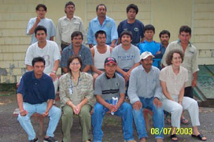 Photo of Dr. Marcia Trap-Cardoso with migrant farm workers