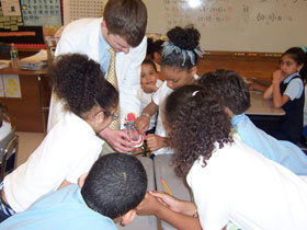 Kyle Sorenson, a second year dental student, discusses taking care of teeth with Hartford school children.