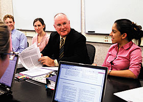 Dr. R. Lamont “Monty” MacNeil, newly named dean of the dental school, meets with students.