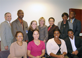 Photo of Chris Montross, Granville Wrensford, Melenie Magnotta, Sharon Dalton, Anne Beal, Marja Hurley, Keith Carter and medical and dental students