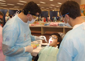 Photo of Zachary Goldman treating a patient