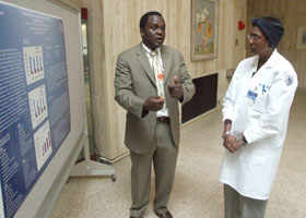 Photo of Johnson Prophete speaking with Dr. Marja Hurley