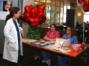 Cardiology staff members Marie Kazimierczak and Johanny Rivera provide information about heart disease