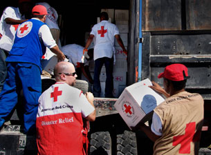 Photo of the Haitian Red Cross, American Red Cross and Colombian Red Cross packing supplies