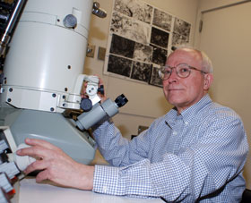 Dr. Kent Morest, a professor of neuroscience, uses an electron microscope to conduct research on hearing loss.