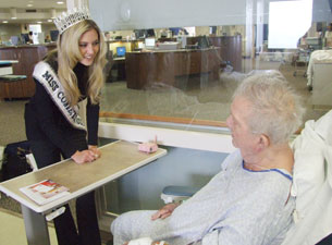Photo of Ashley Bickford with a patient 