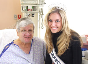 Photo of Ashley Bickford with a patient 