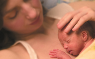 Mother providing kangaroo care to her newborn in the Health Center's NICU