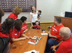 Photo of a parent thanking Bank of America employees