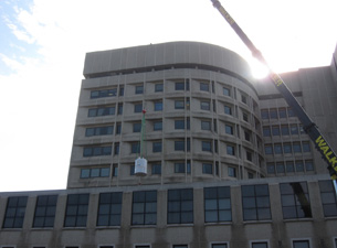 Photo of magnet being lifted by crane