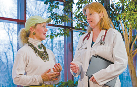 Dr. Cheryl Oncken, right, associate professor of medicine, speaks with Mary Carroll Root, an instructor with Powerful Aging, an exercise program developed at the Health Center.