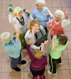 Photo of Dr. Cheryl Oncken surrounded by women exercising