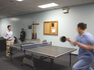 Photo of players competing during the UCHC Ping Pong Tourney