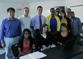 Photo of Dr. Craig Rodner and second-year medical students during the filming of the Health Center's new television ad.