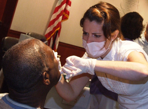 Photo of Kerrie OBrien conducting an oral screening