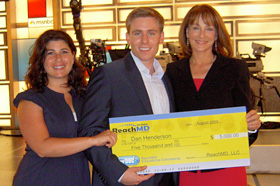UConn medical student Dan Henderson accepts a $5,000 scholarship from Dr. Nancy Snyderman, chief medical editor at NBC News (right) and Julie Carson from the satellite radio channel ReachMD.