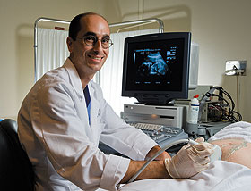 Maternal fetal medicine specialist Dr. Jeffrey Spencer of the UConn Health Center performs an ultrasound.