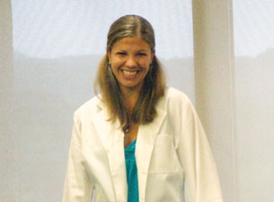Female student after being presented with a white coat