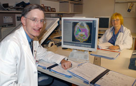 Dr. Robert Dowsett and Karen Stook of the Health Center’s radiation oncology department are planning for next summer’s installation of TomoTherapy equipment. The machine will offer a new type of cancer therapy.