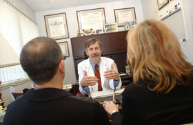 Dr. John Nulsen, medical director of the Center for Advanced Reproductive Services at the Health Center, counsels a couple about fertility treatment options.