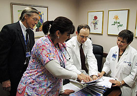 From left, Charles Huntington, Kim Kingsland, Dr. Joseph Anderson, and Judy Conway, discuss the pilot program that will provide colon cancer screening to uninsured and underinsured Connecticut residents.