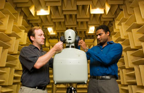 Donald Peterson, left, an assistant professor of medicine, and Subhash Gullapalli, a research engineer, working in an anechoic chamber at the Health Center.